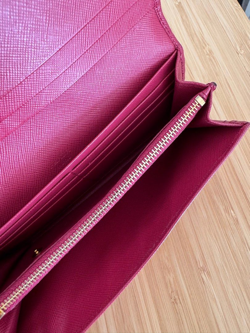Prada Saffiano Leather Bow Flap Wallet (Category: Luxury Bags & Wallets) located in Naga. Submitted by declu.eve (Listing ID 1401215815, Image 3). Description: AUTHENTIC prada long wallet with free chain. Can send more photos and vids. Just pm me! Price slightly negotiable .