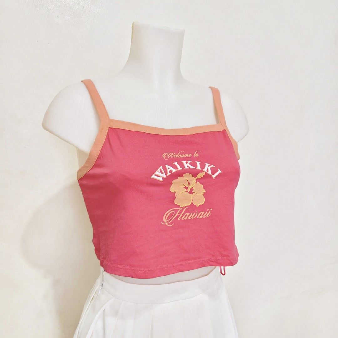Primark Waikiki Crop Top XS (Category: Others Tops) located in Manila. Submitted by itseyren (Listing ID 1401176362, Image 2). Description: - Pink crop top - Orange trim and straps - "Welcome to Waikiki Hawaii" graphic - Size: XS .