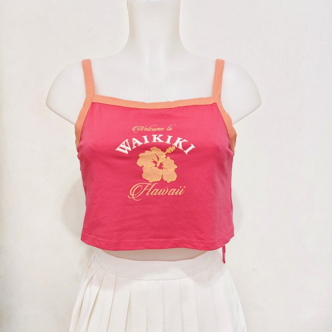 Primark Waikiki Crop Top XS (Category: Others Tops) located in Manila. Submitted by itseyren (Listing ID 1401176362, Image 1). Description: - Pink crop top - Orange trim and straps - "Welcome to Waikiki Hawaii" graphic - Size: XS .
