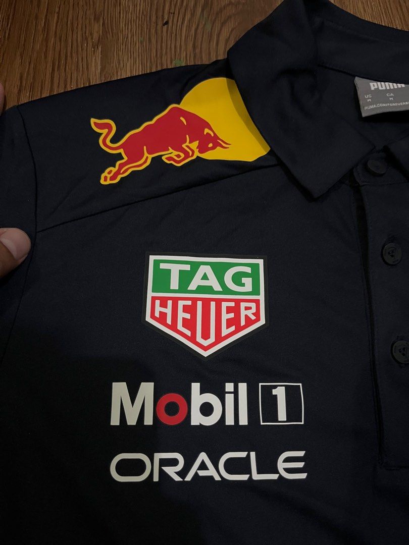 Puma Redbull Racing Polo Shirt Medium (Category: Tshirts & Polo Shirts ) located in Ragay. Submitted by eemensapparel (Listing ID 1401274717, Image 3). Description: Dimensions 28.5 x 20.5 Like new No crack prints Hang tag na lang kulang .