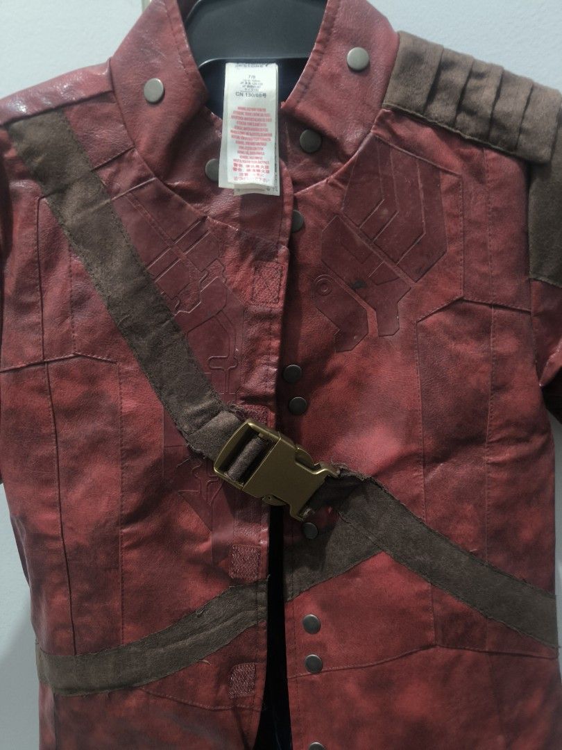 Avengers Marvel StarLord Cosplay Coat (Category: Babies & Kids Fashion) located in Pasig City. Submitted by keibee14 (Listing ID 1401309670, Image 3). Description: - Star-Lord cosplay coat - Red and brown color scheme - Buckle closure - Shoulder accents - Long design - Leather-like material - Detailed front and back design - Unique chest emblem preloved. expect signs of use but pretty decent and the details are very nice and almost real despite t