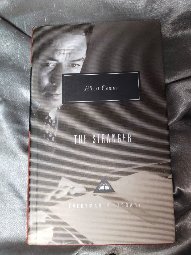 The Stranger by Albert Camus (Everyman's Library) (Category: Storybooks) located in Quezon City. Submitted by phick (Listing ID 1401169107, Image 1). Description: Albert Camus's "The Stranger" from Everyman's Library. The book features a red spine and a black and white cover. The pages are clean and the text is in English. The book is translated from the French by Matthew Ward. It includes an introduction by Peter Brooks..