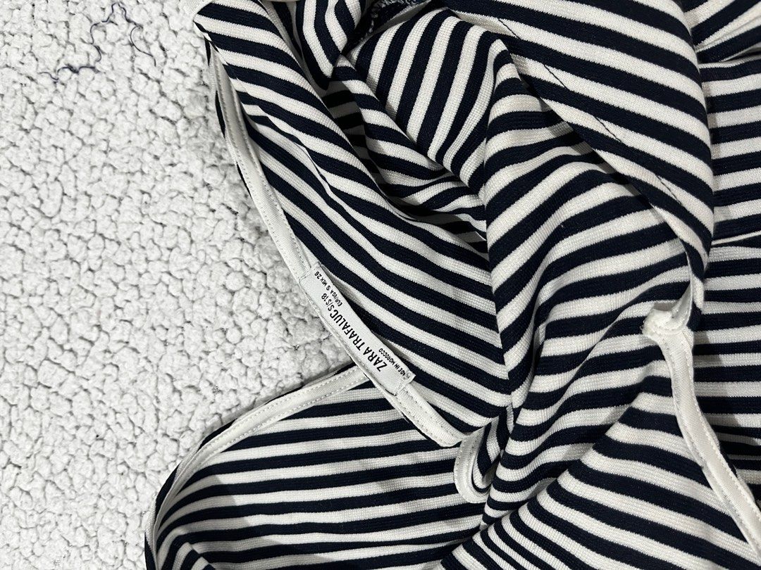 Zara Striped Romper (Category: Rompers) located in San Fernando. Submitted by declutterbydani__ (Listing ID 1401278346, Image 3). Description: body fitting with ruffles on both ends deep vneck.