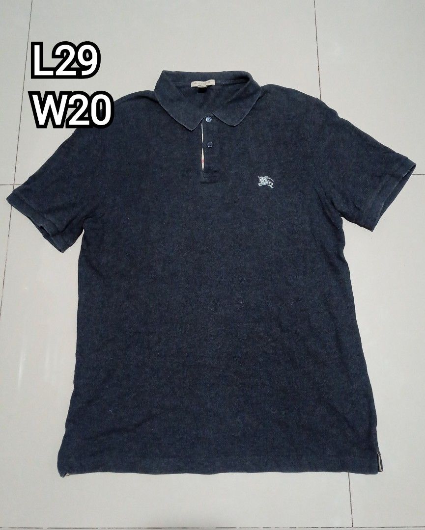 Burberry Polo Shirt (Category: Tshirts & Polo Shirts ) located in Caloocan City. Submitted by wupeeram (Listing ID 1401458409, Image 1). Description: - Dark grey Burberry polo shirt - Features Burberry logo on chest - Made in Turkey - Classic polo collar and short sleeves - Size tag visible.