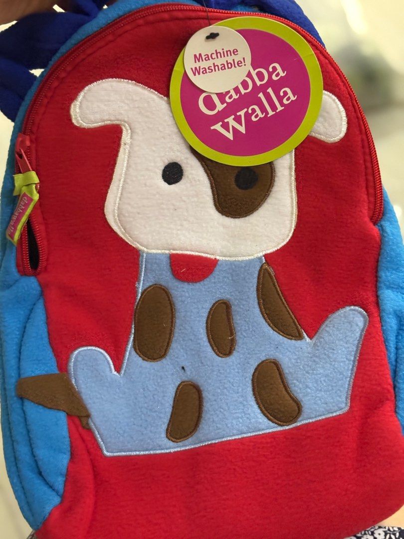 gift ! Dabba walla dog super cute backpack for kids (Category: Other Babies Going Out Needs) located in Manila. Submitted by chandleria (Listing ID 1401371405, Image 2). Description: - Adorable dog backpack - Features a cute red and blue dog design - Includes a zipper closure and top handle - Machine washable - Perfect for toddlers and young children super cute fleece and neoprene fabric washable and convertible backpack to sling bag.