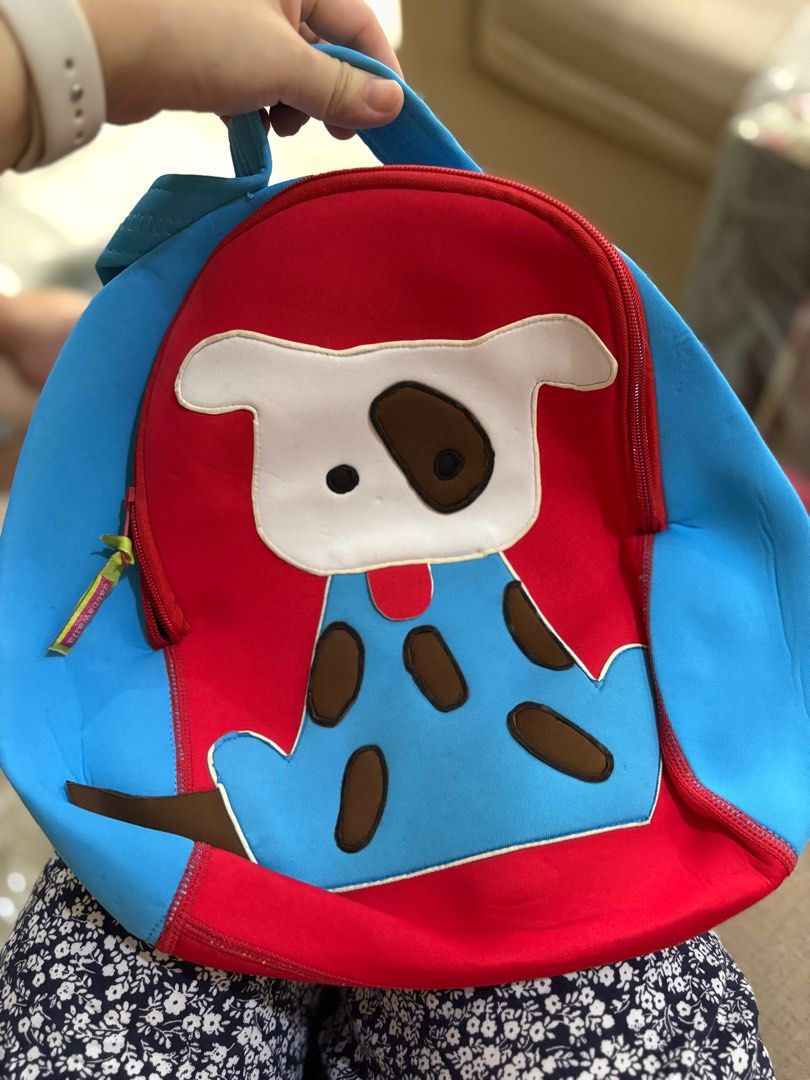 gift ! Dabba walla dog super cute backpack for kids (Category: Other Babies Going Out Needs) located in Manila. Submitted by chandleria (Listing ID 1401371405, Image 1). Description: - Adorable dog backpack - Features a cute red and blue dog design - Includes a zipper closure and top handle - Machine washable - Perfect for toddlers and young children super cute fleece and neoprene fabric washable and convertible backpack to sling bag.