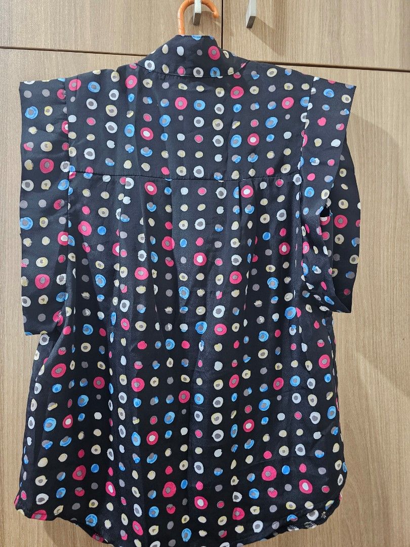 Details Black Polka Dot Blouse (Category: Blouses) located in Quezon City. Submitted by jddss (Listing ID 1401430178, Image 2). Description: Black polka dot blouse - Brand: Details - Size on tag: XS (but can fit S-M) - Features: Collared neckline, button-down front - Material: Smooth/silky - Great for retro/disco-themed parties - RFS: Di na nagagamit Please feel free to message for inquiries! 😊.
