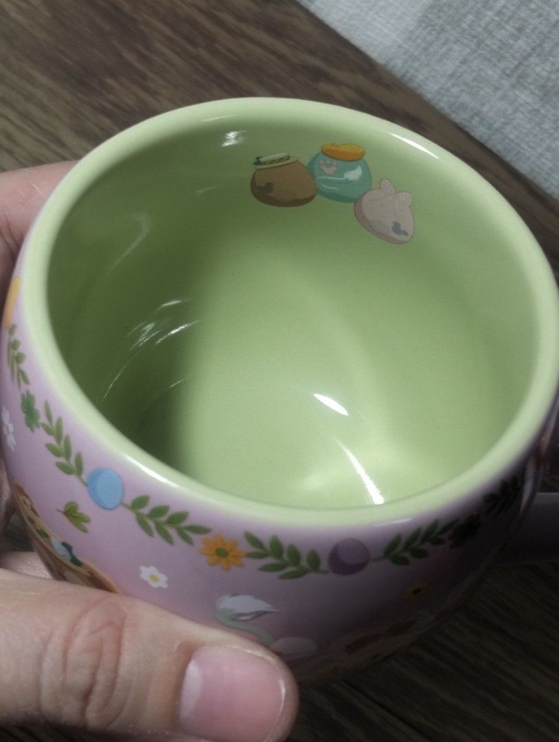 Duffy Cape Cod Springtime Mug (Category: Coffee & Tea Tableware) located in Batangas. Submitted by amerie_store (Listing ID 1401412106, Image 3). Description: -Adorable mug features Duffy and friends with a Cape Cod Springtime design. It has a light pink exterior with a green interior. The bottom of the mug indicates it is from Tokyo DisneySea. It is perfect for enjoying your favorite beverages. Made in Thailand. -WYSIWYG 🔊Kindly visit & follow 