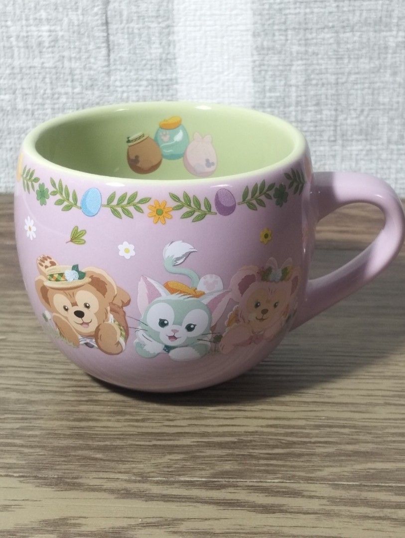 Duffy Cape Cod Springtime Mug (Category: Coffee & Tea Tableware) located in Batangas. Submitted by amerie_store (Listing ID 1401412106, Image 1). Description: -Adorable mug features Duffy and friends with a Cape Cod Springtime design. It has a light pink exterior with a green interior. The bottom of the mug indicates it is from Tokyo DisneySea. It is perfect for enjoying your favorite beverages. Made in Thailand. -WYSIWYG 🔊Kindly visit & follow 