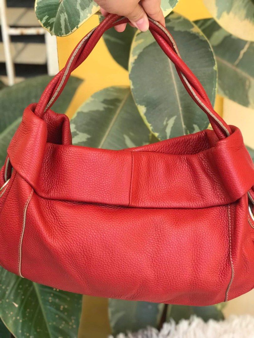 FURLA Red Leather Tote Bag (Category: Luxury Bags & Wallets) located in Lapu Lapu. Submitted by glamorouslybeautiful8.0 (Listing ID 1401373175, Image 1). Description: ☘️👜♥️F U R L A genuine pebbled leather hobo bag/shoulder bag/kili bag in red Made in 🇮🇹 Italy PreL🌸ved Medium (LwH:14x3x10inches) Whooaahh sassy leather hobo in gorgeous red💘💘 Silver hardwares With entwined leather handles 🌻Flaws: rubber sealant cracks only as shown otherwise