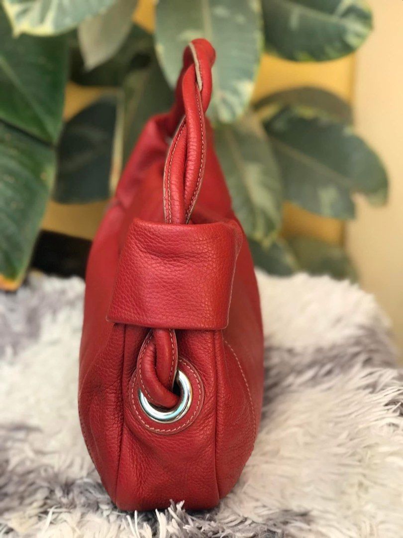 FURLA Red Leather Tote Bag (Category: Luxury Bags & Wallets) located in Lapu Lapu. Submitted by glamorouslybeautiful8.0 (Listing ID 1401373175, Image 3). Description: ☘️👜♥️F U R L A genuine pebbled leather hobo bag/shoulder bag/kili bag in red Made in 🇮🇹 Italy PreL🌸ved Medium (LwH:14x3x10inches) Whooaahh sassy leather hobo in gorgeous red💘💘 Silver hardwares With entwined leather handles 🌻Flaws: rubber sealant cracks only as shown otherwise