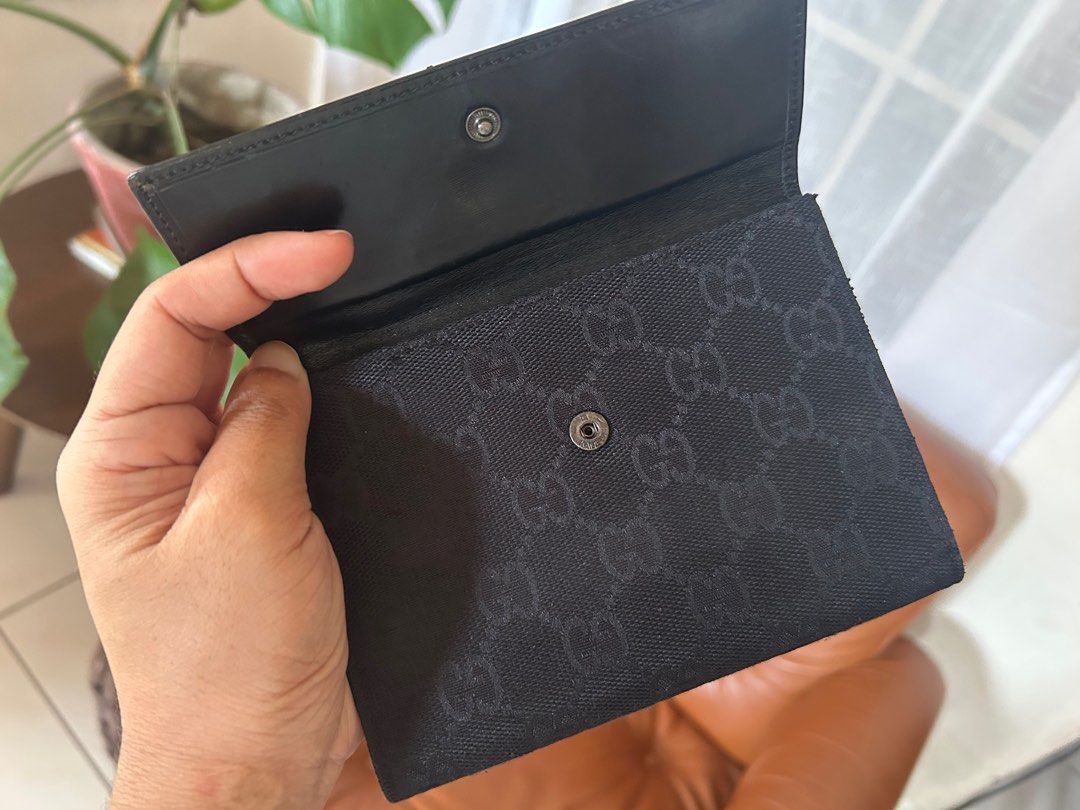 Gucci Black Canvas Wallet (Category: Luxury Bags & Wallets) located in Polangui. Submitted by joycehaul (Listing ID 1401401051, Image 3). Description: Vintage Gucci Jackie Black GG Monogram Cloth & Leather Wallet with silver hardware.
