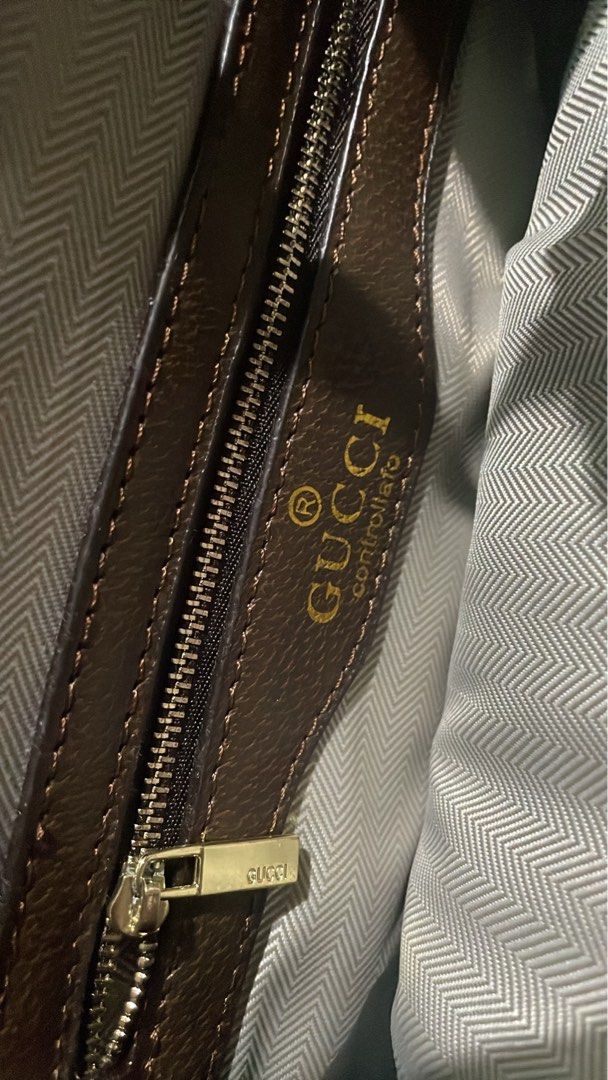 Gucci Embroidered Tote Bag (Category: Luxury Bags & Wallets) located in Pasay City. Submitted by khxore (Listing ID 1401382574, Image 2). Description: - Gucci tote bag - Embroidered floral design - Brown leather handle - Detachable shoulder strap with green and red stripe - Interior zipper pocket and fabric lining - Made in Italy - Not sure about the authenticity of the bag so selling it for a low price! .
