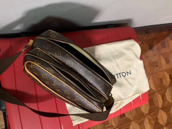 Louis Vuitton Reporter PM Shoulder Bag (Category: Luxury Bags & Wallets) located in Noveleta. Submitted by declutteringsitita (Listing ID 1401456615, Image 3). Description: - Authentic Louis Vuitton Reporter PM shoulder bag - Iconic monogram canvas - Brown leather strap and trim - Includes dust bag - Two main compartments with zipper closures - Perfect for everyday use.