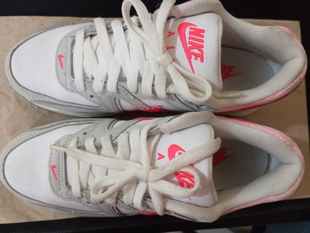 Nike Air Max Sneakers - White/Pink (Category: Sneakers) located in Quezon City. Submitted by AuthenticGoods4U (Listing ID 1401459952, Image 1). Description: - Nike Air Max sneakers - Color: White, grey, and pink - Size: US 7.5, EUR 38.5, CM 24.5 - Features Nike Air logo - Pink air bubble in heel - Used once.