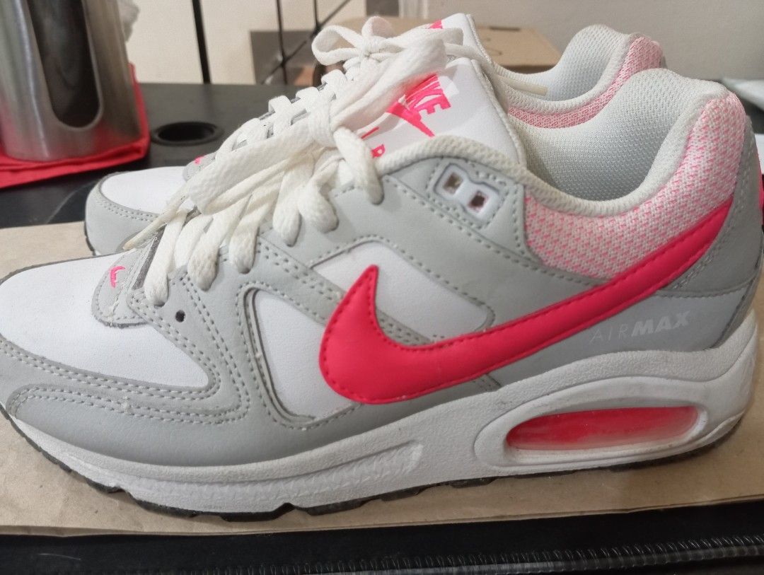 Nike Air Max Sneakers - White/Pink (Category: Sneakers) located in Quezon City. Submitted by AuthenticGoods4U (Listing ID 1401459952, Image 2). Description: - Nike Air Max sneakers - Color: White, grey, and pink - Size: US 7.5, EUR 38.5, CM 24.5 - Features Nike Air logo - Pink air bubble in heel - Used once.