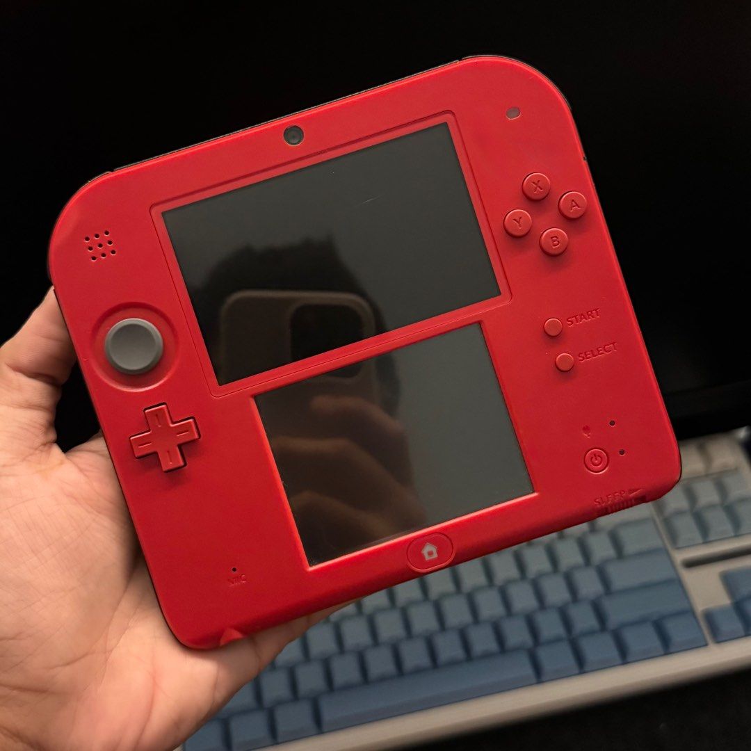 Nintendo 2DS Red 64GB (Category: Nintendo) located in Quezon City. Submitted by consoleciety (Listing ID 1401408773, Image 2). Description: Selling Red Nintendo 2DS 64GB for 7,500PHP —no performance issue, in great condition! —8.8/10 cosmetics —modded 64gb, random games installed & 150+ themes includes unit, usb cord, 64gb sd expect signs of use as unit is second hand. 1. meet-up at Mezza Residences Sta Mesa / FEU Manila 2. Nationwide COD/COP shi