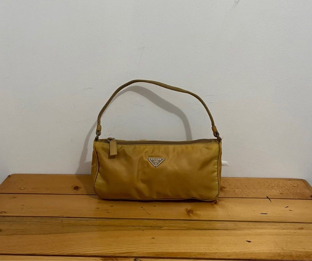 Prada Pochette (Category: Luxury Bags & Wallets) located in Santo Tomas. Submitted by mightypenguin_db692f (Listing ID 1401528817, Image 1). Description: Rank AB Good condition Perfect for everyday bag .