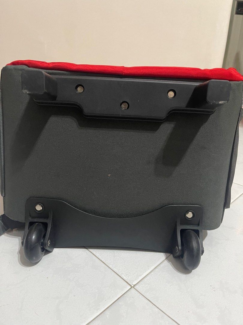 Red Rolling Backpack (Category: Backpacks) located in Singapore. Submitted by _sunsetsunrise_ (Listing ID 1401469012, Image 2). Description: - Red rolling backpack - Ideal for travel - Retractable handle and wheels for easy transport - Multiple storage compartments -Able to nego -Ctb for more -Good condition - Still fully functional.
