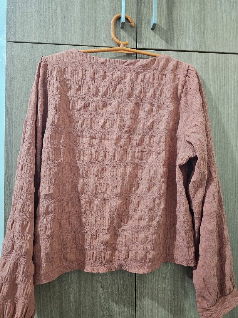 Salmon/Coral Colored Textured Blouse (Category: Blouses) located in Quezon City. Submitted by jddss (Listing ID 1401443148, Image 2). Description: Salmon/Coral Colored Textured Blouse - Size: S - Darker shade sa actual, not sure bakit lighter yung register niya sa phone camera - Light material Free for purchases of at least Php100 😊 .
