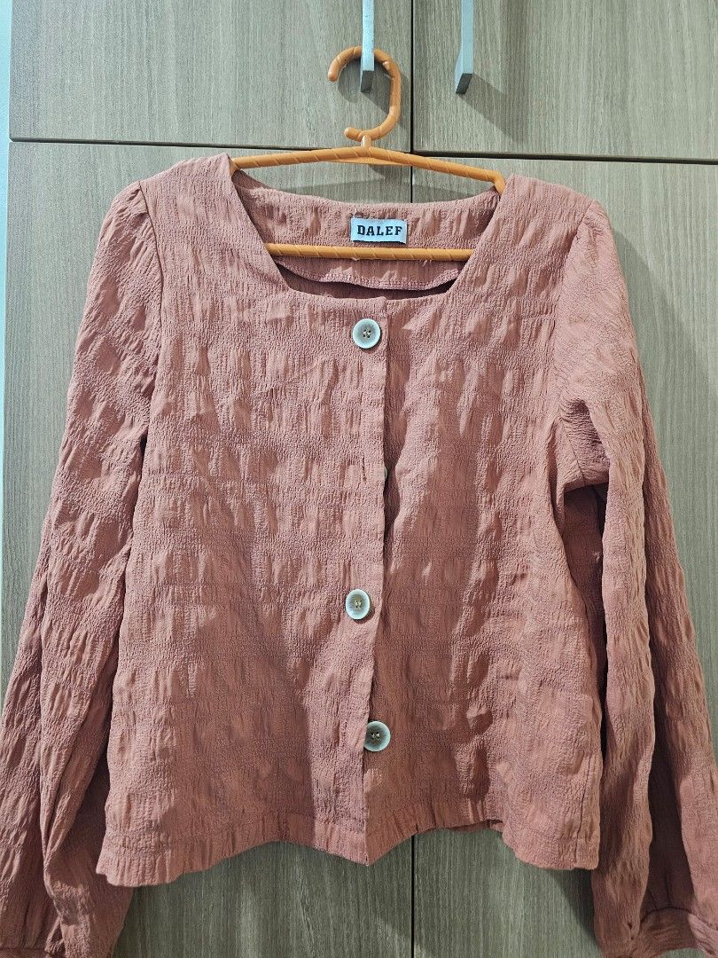 Salmon/Coral Colored Textured Blouse (Category: Blouses) located in Quezon City. Submitted by jddss (Listing ID 1401443148, Image 1). Description: Salmon/Coral Colored Textured Blouse - Size: S - Darker shade sa actual, not sure bakit lighter yung register niya sa phone camera - Light material Free for purchases of at least Php100 😊 .