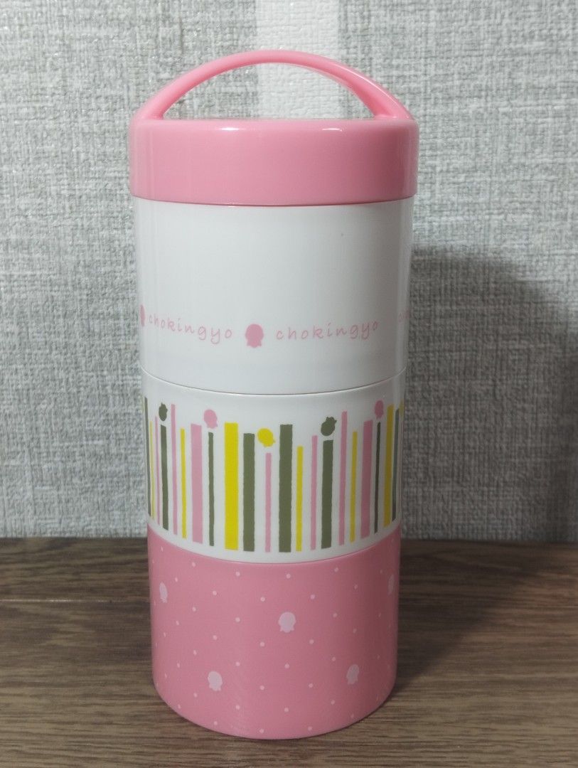 STACKABLE CHOKINGYO BENTO BOX/LUNCH CONTAINER (Category: Food Organization & Storage) located in Batangas. Submitted by amerie_store (Listing ID 1401408571, Image 1). Description: -Pink lunch box features three stackable containers, perfect for separating your food. It includes a lid with a handle for easy carrying. The set comes with a pink spoon and chopsticks, stored in a dedicated compartment. The containers have different designs, including 