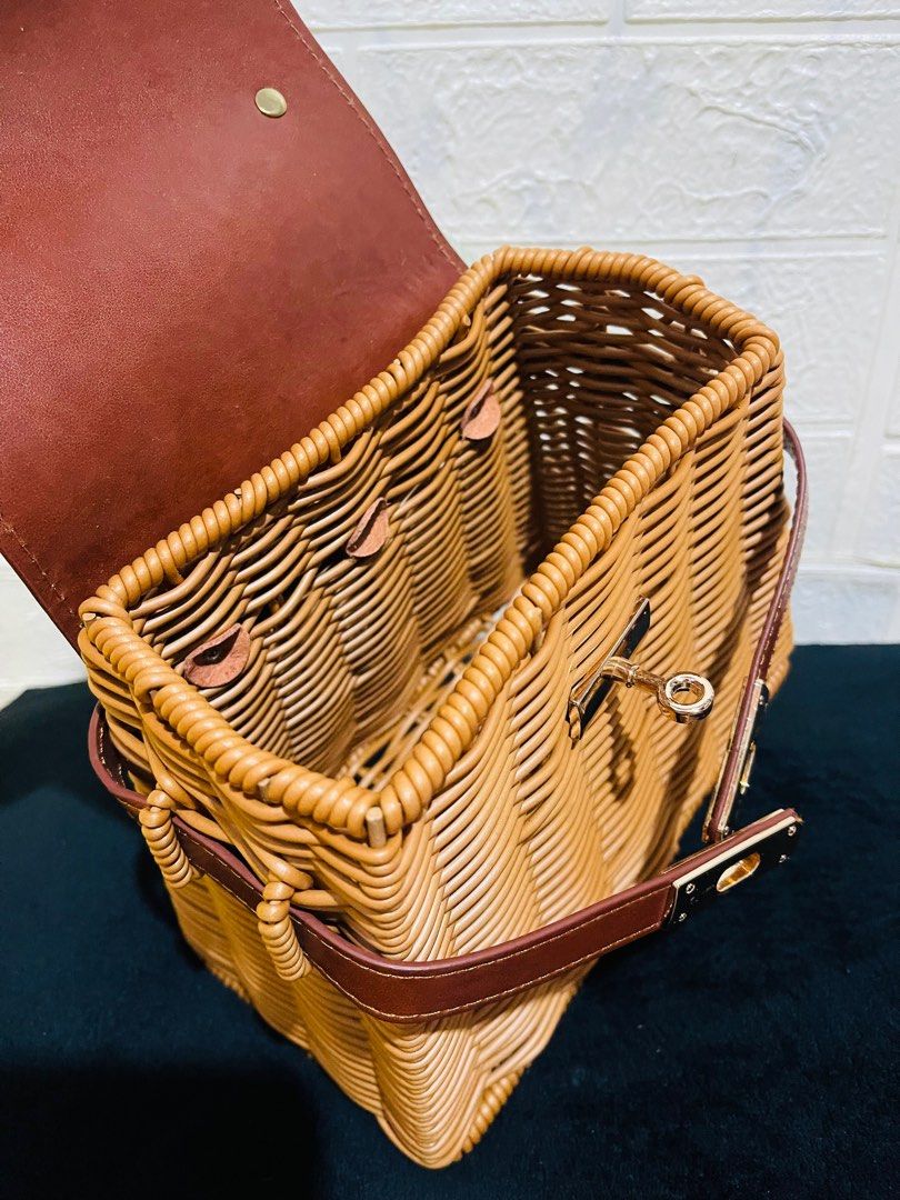 Wicker Handbag with Brown Leather Flap (Category: Luxury Bags & Wallets) located in San Pablo. Submitted by shenettdaily (Listing ID 1401355141, Image 3). Description: - Woven wicker body - Brown leather flap closure - Top handle with green and white patterned scarf - Brown leather strap - Gold-colored clasp - Spacious interior +50 sf Laguna.