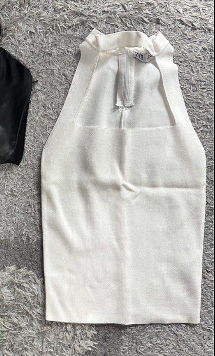 Zara Ribbed Halter Top (Category: Sleeveless) located in San Juan City. Submitted by decluttzi (Listing ID 1401439958, Image 2). Description: - Zara halter top - White color - Square neckline - Zipper closure at the back - Knit fabric.