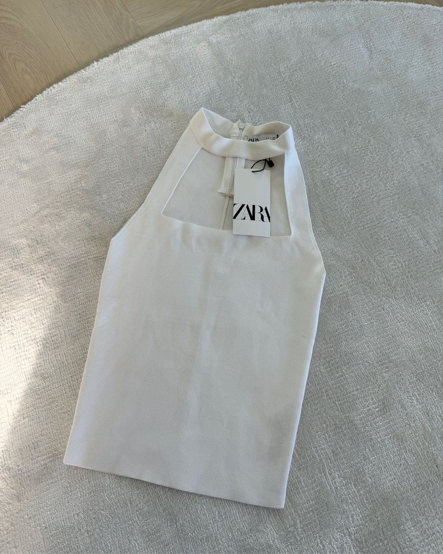 Zara Ribbed Halter Top (Category: Sleeveless) located in San Juan City. Submitted by decluttzi (Listing ID 1401439958, Image 1). Description: - Zara halter top - White color - Square neckline - Zipper closure at the back - Knit fabric.