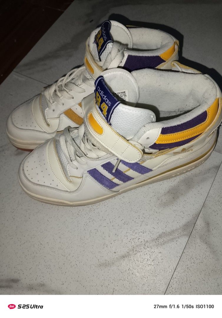 Adidas Forum 84 High Top Sneakers (Category: Sneakers) located in Manila. Submitted by marcus42 (Listing ID 1396394449, Image 1). Description: - Adidas Forum 84 high-top sneakers - Color: White, Yellow, and Purple - Features Adidas logo - High-top design - Strap closure - Rubber sole - Made in Vietnam - Size: US 11, UK 10 1/2, EUR 45 1/3.
