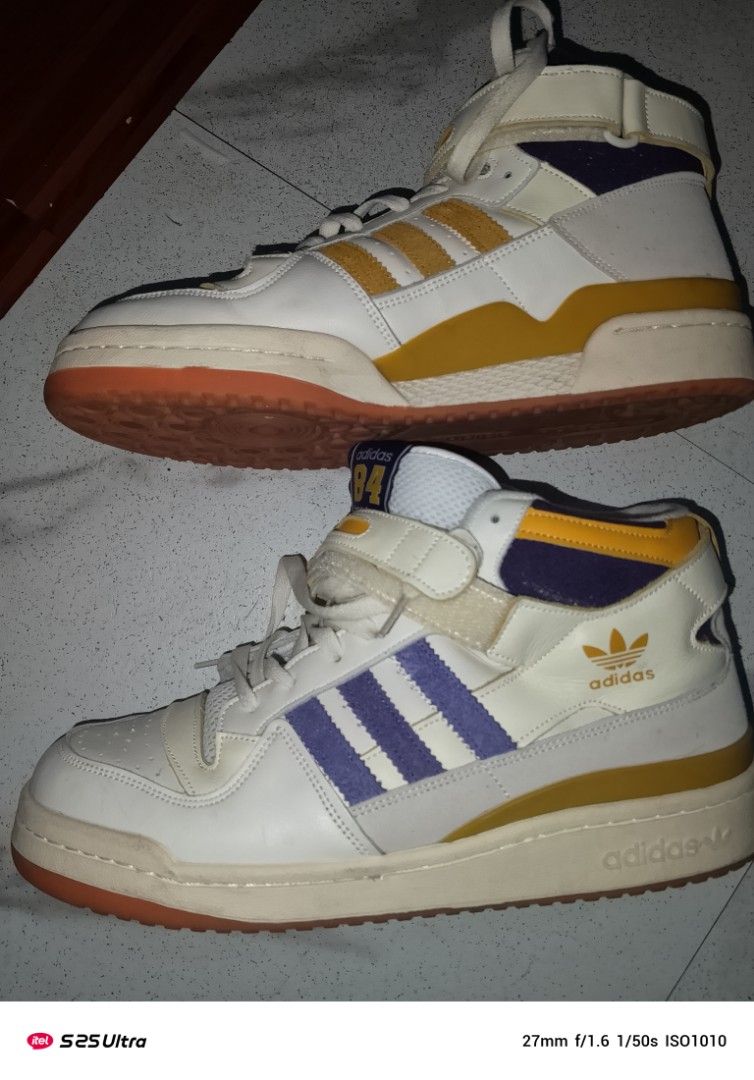 Adidas Forum 84 High Top Sneakers (Category: Sneakers) located in Manila. Submitted by marcus42 (Listing ID 1396394449, Image 2). Description: - Adidas Forum 84 high-top sneakers - Color: White, Yellow, and Purple - Features Adidas logo - High-top design - Strap closure - Rubber sole - Made in Vietnam - Size: US 11, UK 10 1/2, EUR 45 1/3.