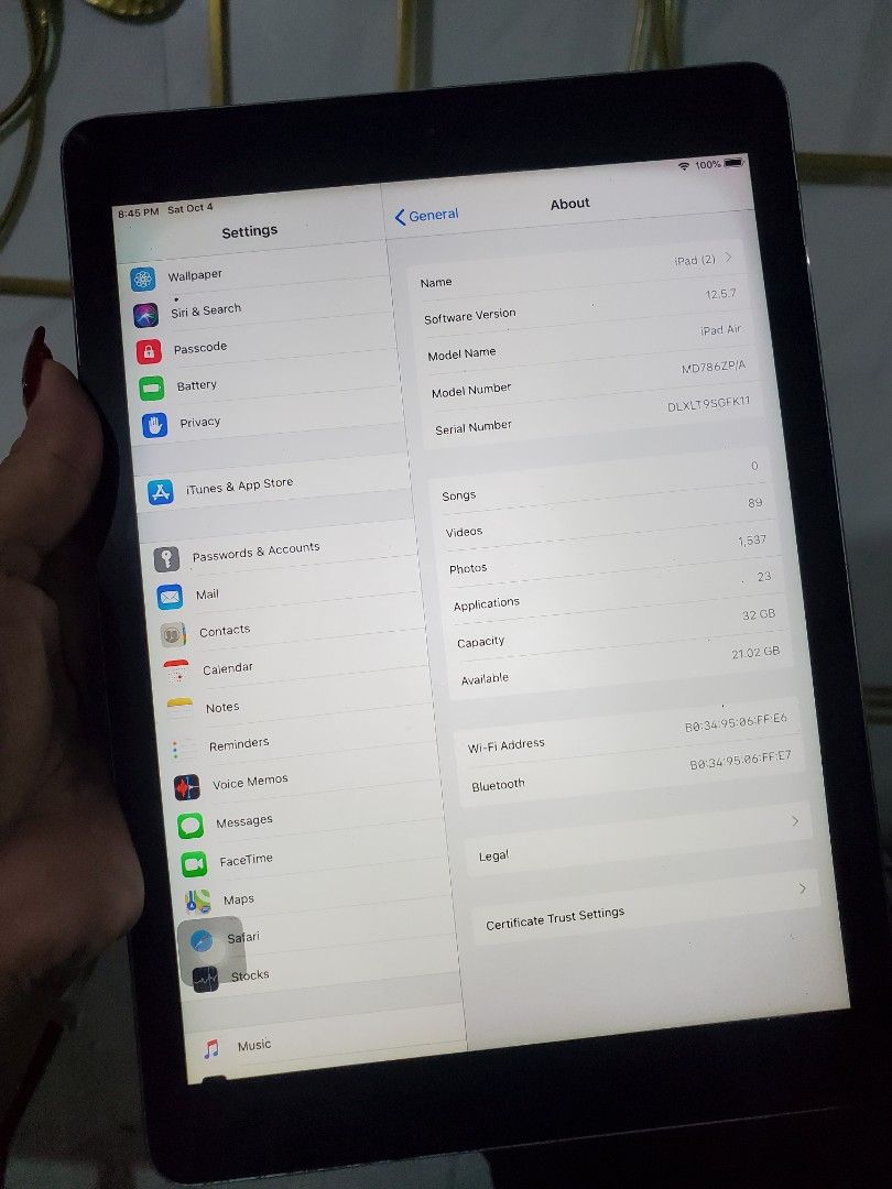 Apple iPad air 1 (Category: iPad) located in Manila. Submitted by gadialenie61782 (Listing ID 1396470903, Image 1). Description: - Apple iPad air 1 - Good working condition - Black color - Features a home button - Displays apps and settings on screen - Apple logo and "iPad" on the back - Model: MD786ZP/A.
