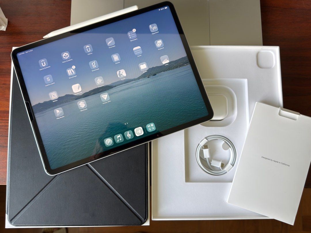 (Category: iPad) located in Singapore. Submitted by eggsandbread (Listing ID 1396339810, Image 1). Description: Selling a used Apple iPad Pro 12.9-inch (5th Gen) in silver. Comes with original box, charger, and Apple Pencil. There are a few minor cosmetic imperfections on the corners, as shown in the photos. Apple care warranty expires on 07 Oct 2025. Comes with Pitaka case, Apple Pencil gen 2, box, charger and cable. RFS: Switched to e-ink devic
