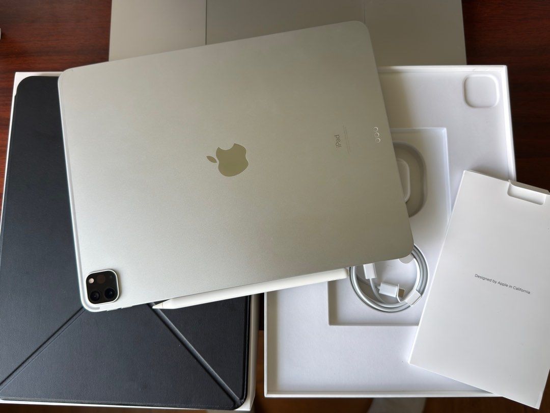 (Category: iPad) located in Singapore. Submitted by eggsandbread (Listing ID 1396339810, Image 3). Description: Selling a used Apple iPad Pro 12.9-inch (5th Gen) in silver. Comes with original box, charger, and Apple Pencil. There are a few minor cosmetic imperfections on the corners, as shown in the photos. Apple care warranty expires on 07 Oct 2025. Comes with Pitaka case, Apple Pencil gen 2, box, charger and cable. RFS: Switched to e-ink devic