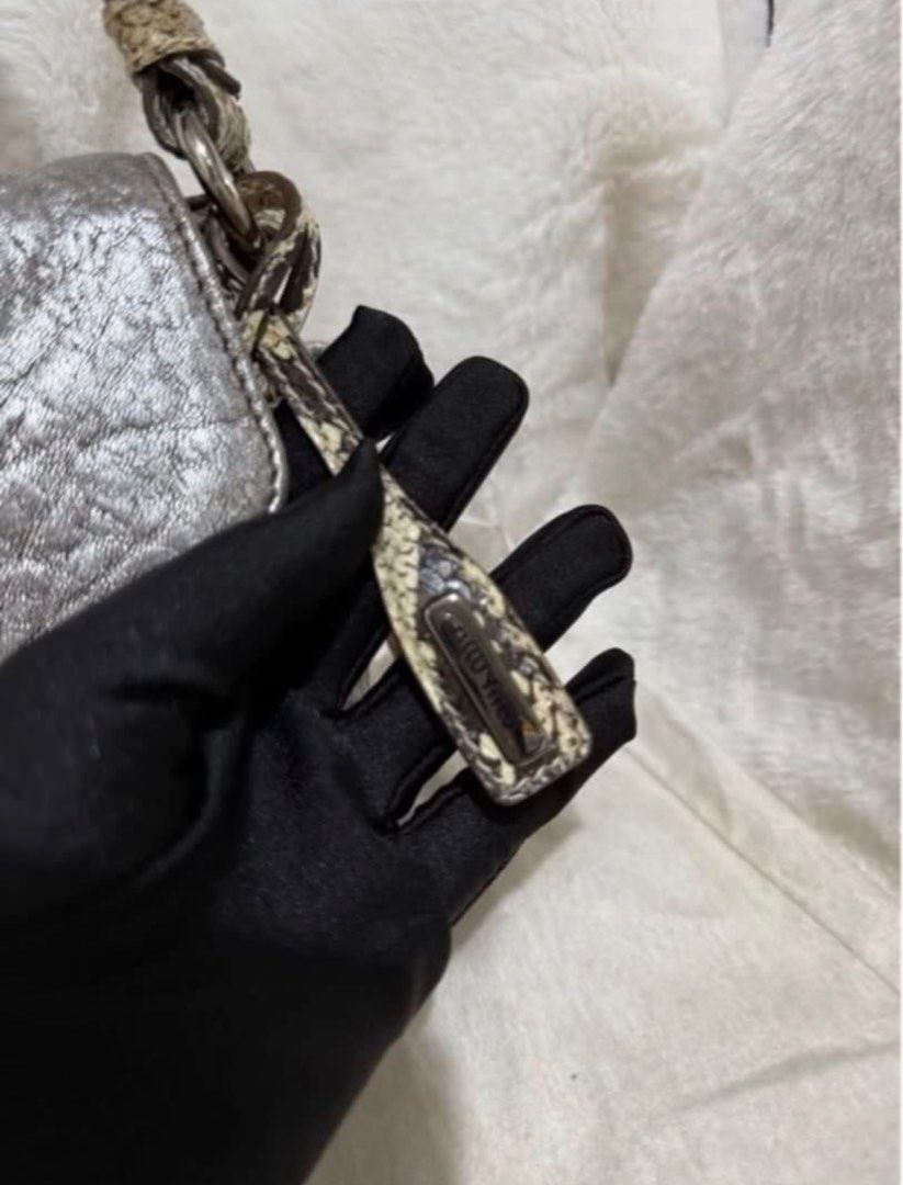 Authentic Miu Miu Back Python Handbag Shoulder Bag Leather Silver (Category: Luxury Bags & Wallets) located in Paranaque City. Submitted by authentic_mj (Listing ID 1396355798, Image 2). Description: Authentic Miu Miu Back Python Handbag Shoulder Bag Leather Silver Preloved Authentic from UAE With dustbag With cards.