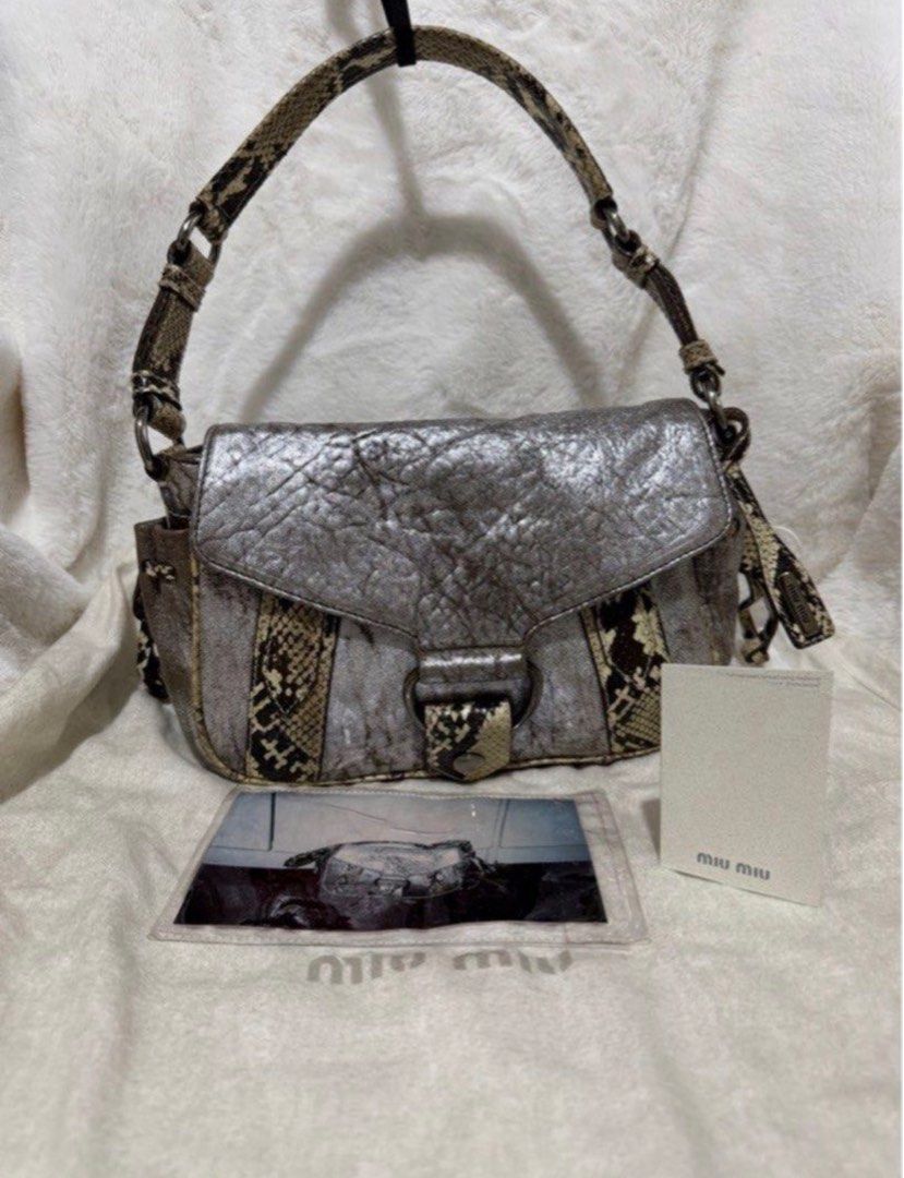 Authentic Miu Miu Back Python Handbag Shoulder Bag Leather Silver (Category: Luxury Bags & Wallets) located in Paranaque City. Submitted by authentic_mj (Listing ID 1396355798, Image 1). Description: Authentic Miu Miu Back Python Handbag Shoulder Bag Leather Silver Preloved Authentic from UAE With dustbag With cards.