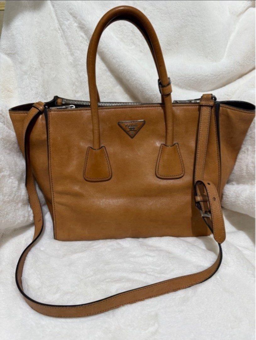 Authentic Prada Brown Glace Calf. Leather Twin Pocket (Category: Luxury Bags & Wallets) located in Paranaque City. Submitted by authentic_mj (Listing ID 1396355278, Image 1). Description: Authentic Prada Brown Glace Calf. Leather Twin Pocket Double Handle Tote Double Zip Leather Interior & Exterior Preloved Authentic from UAE No inclusions Flaws: watermarks.