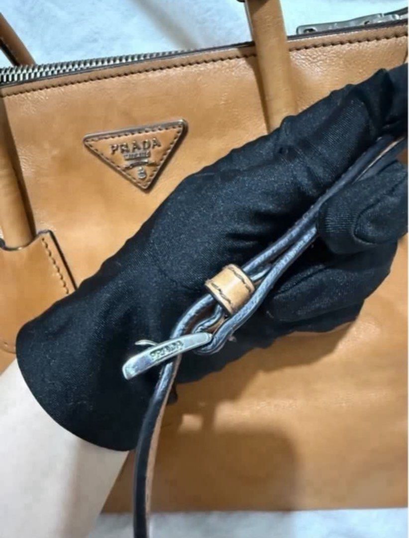 Authentic Prada Brown Glace Calf. Leather Twin Pocket (Category: Luxury Bags & Wallets) located in Paranaque City. Submitted by authentic_mj (Listing ID 1396355278, Image 3). Description: Authentic Prada Brown Glace Calf. Leather Twin Pocket Double Handle Tote Double Zip Leather Interior & Exterior Preloved Authentic from UAE No inclusions Flaws: watermarks.