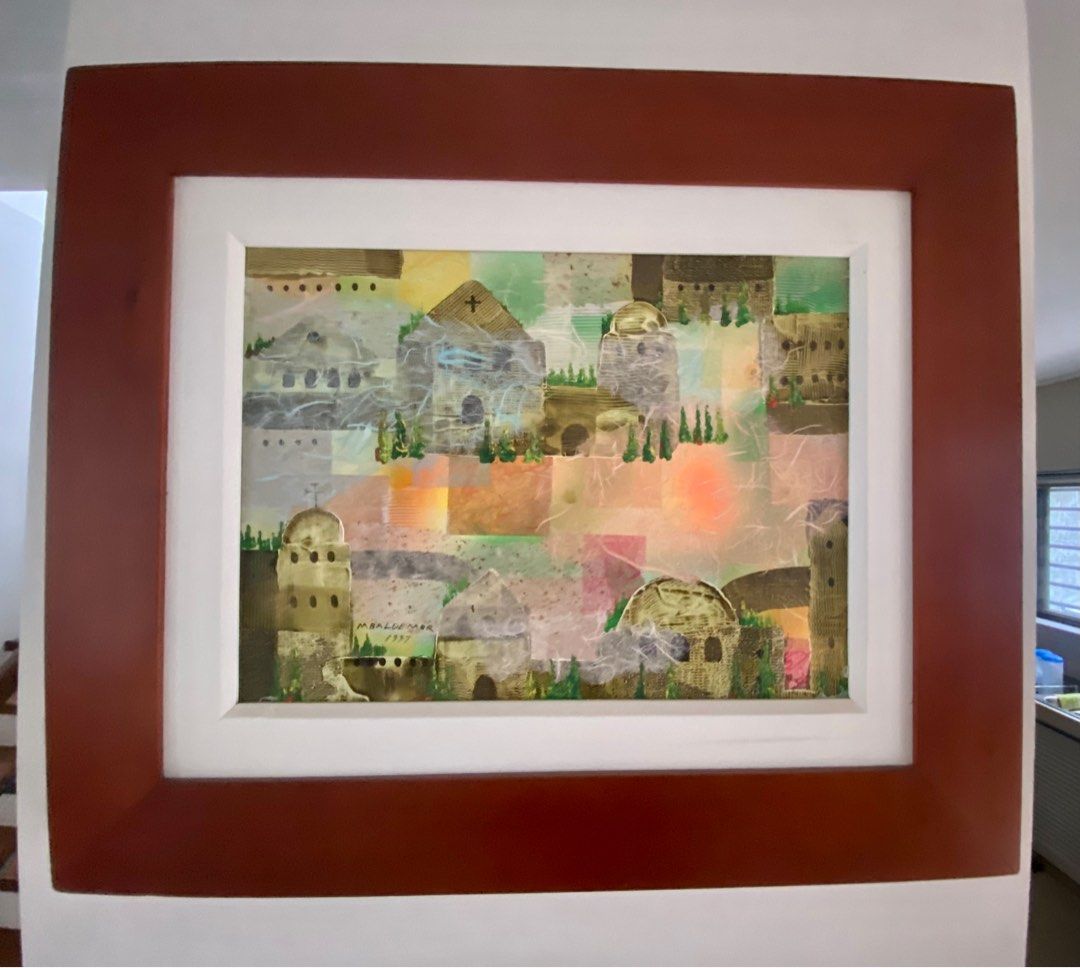 Manuel D. Baldemor Framed Abstract Painting (Category: Art & Prints) located in Manila. Submitted by ina.manila (Listing ID 1396469290, Image 1). Description: - Framed abstract painting (12x16 inches) - Depicts a colorful cityscape. - Features a warm, sunset-like glow. - Set in a white mat and dark brown wooden frame. - Ideal for home decor..