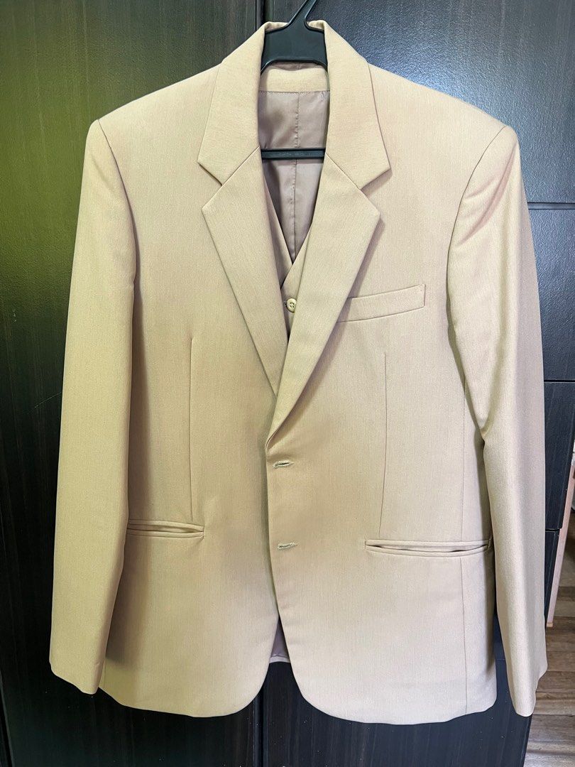 Beige coat or blazer with matching vest (Category: Coats, Jackets and Outerwear) located in Paranaque City. Submitted by decluttering1990 (Listing ID 1396315776, Image 1). Description: Beige coat with matching vest Php2000 for both Used three times; professionally dry cleaned after each use and stored with plastic cover Both with lining Custom made; not standard size Coat has 2 buttons and no vent, 2 inner pockets Vest has 5 buttons; no adjustmen