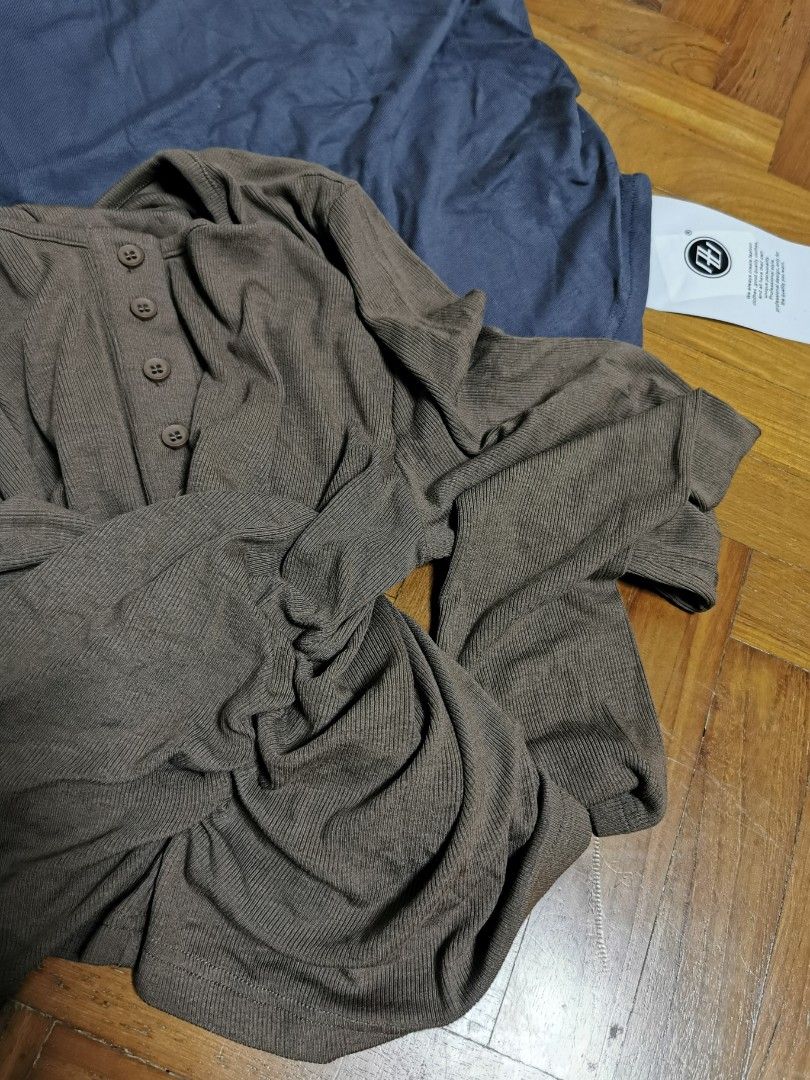 BrandNew Tops - tencel soft material T-shirts 2 pics bundle deal (Category: Blouses) located in Singapore. Submitted by foxandbear (Listing ID 1396447653, Image 3). Description: - Two brand new tops - Includes: - Brown long-sleeved top with buttons chest 80-110cm length45-50cm - Blue V-neck top chest 82-110cm. Length 45-55cm - Both tops feature ruched sides - Brand new with tags 28.