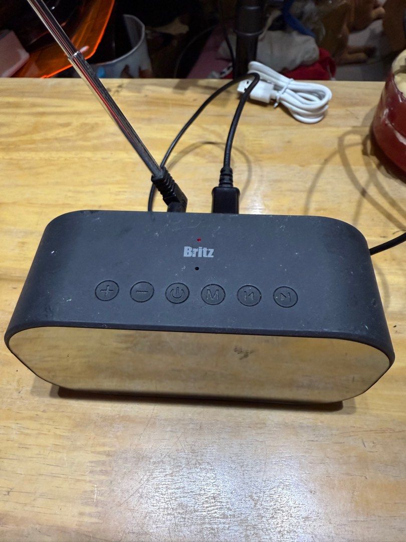 Britz BZ-V900S Digital Clock Radio (Category: Portable Music Players) located in Pilar. Submitted by faveanyshop (Listing ID 1396442667, Image 3). Description: - Mirrored display: Shows time, temperature, and humidity. - Built-in FM radio. - Bluetooth connectivity. - USB and AUX ports. - Powered by DC 5V adapter. - Sleek, rectangular design. - Control buttons on top..