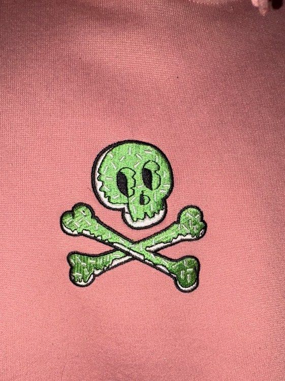 Bum Premium Goods Hoodie (Category: Hoodies) located in Quezon City. Submitted by jin_00 (Listing ID 1396378703, Image 2). Description: - Pink Bum Premium Goods hoodie - Features a skull and crossbones design - Slim fit, size S - Includes a hood and front pocket - Bum logo detail on the neckline.