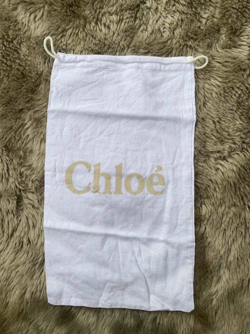 (5% off)❣️ Chloe Dust Bag (Category: Luxury Bags & Wallets) located in Manila. Submitted by avathriftedcloset (Listing ID 1396445128, Image 1). Description: - Authentic Chloe dust bag - Features Chloe logo in light gold - Made of white fabric - Drawstring closure - Protects your Chloe bag from dust and scratches - Perfect addition to your Chloe collection.