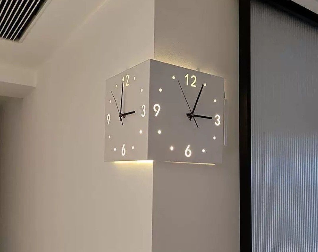 Corner Wall Clock (Category: Clocks) located in Kota Bharu. Submitted by Bonza (Listing ID 1396286451, Image 3). Description: - Unique corner wall clock - Square design - White color - Illuminated dots for hours - Two-faced design - Black hands.