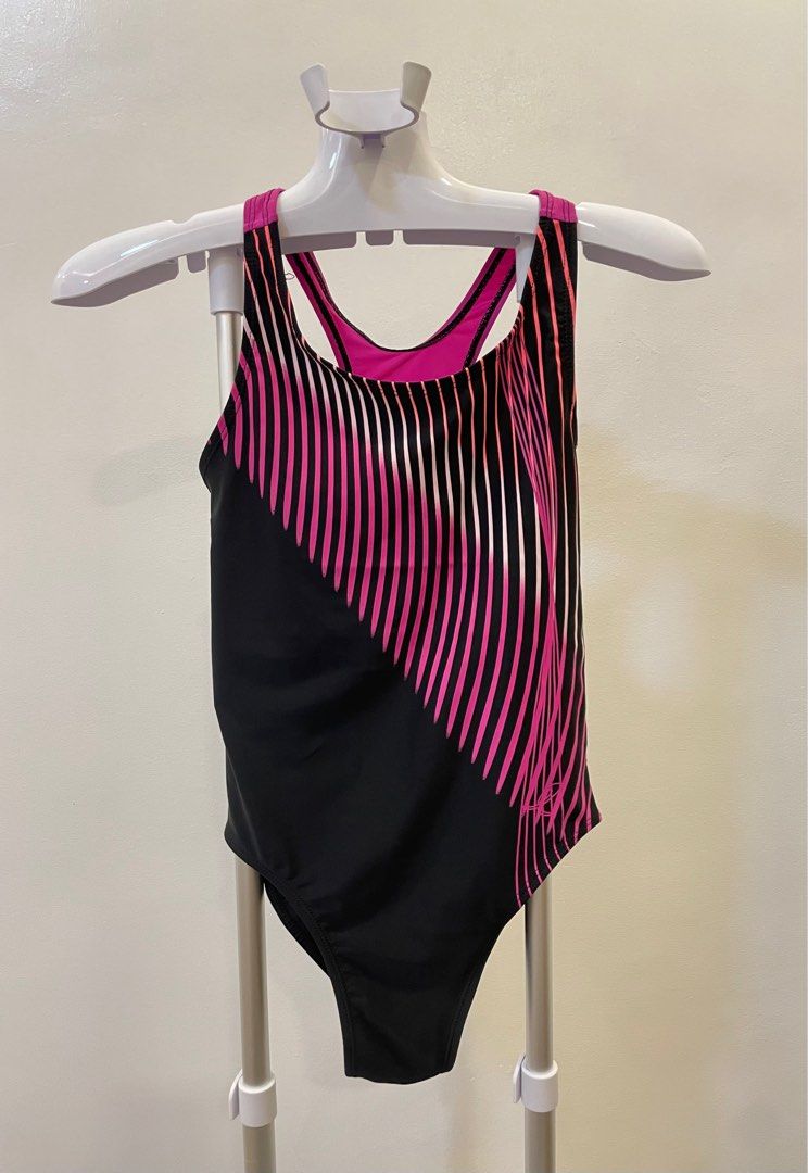 Energetics Swimsuit - Black and Pink (Category: Bikinis & Swimsuits) located in Caloocan City. Submitted by qbcloset (Listing ID 1396439998, Image 3). Description: Stylish Energetics swimsuit featuring a black base with a diagonal pink and white striped design. It has a racerback design with a pink accent. The back of the swimsuit has a keyhole design. The Energetics logo is visible on the back..