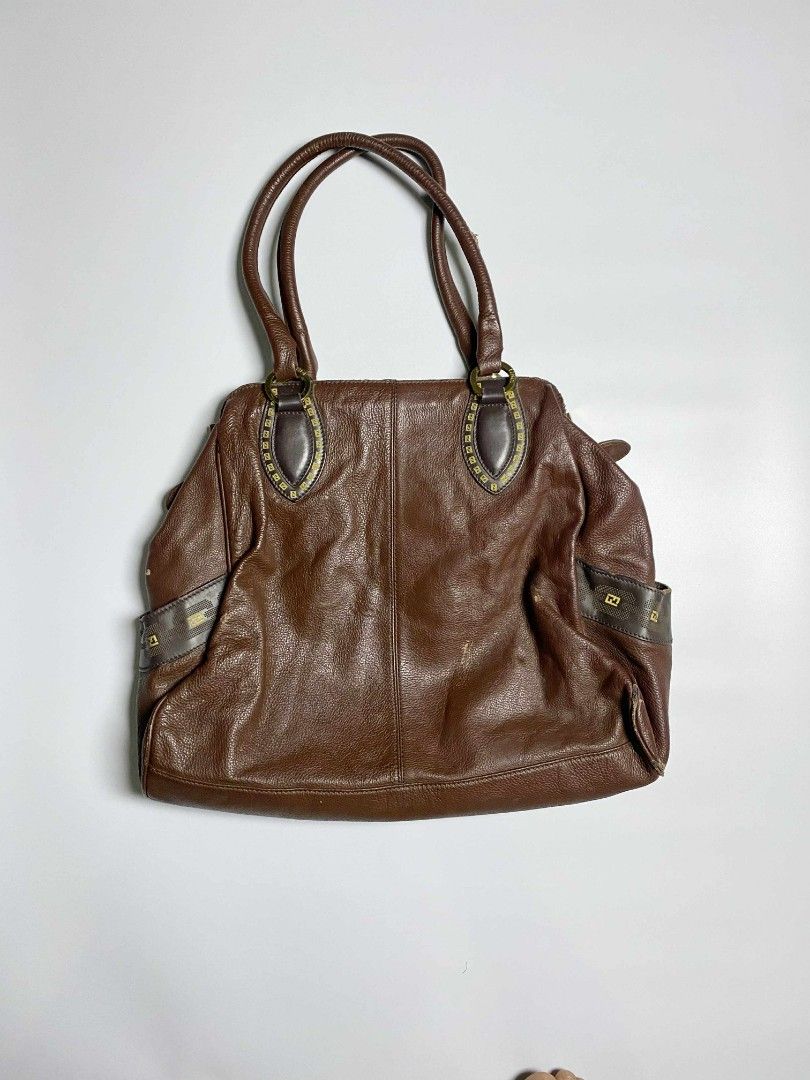 Fendi Brown Leather Handbag (Category: Luxury Bags & Wallets) located in Tarlac. Submitted by pearl_xoxo (Listing ID 1396329693, Image 2). Description: Fendi Leather Bag Off/ Legit Size: large Issue: Pic below - Fendi brown leather handbag - Features large Fendi logo - Two top handles - Zipper closure - Brown fabric lining with zipper pocket.