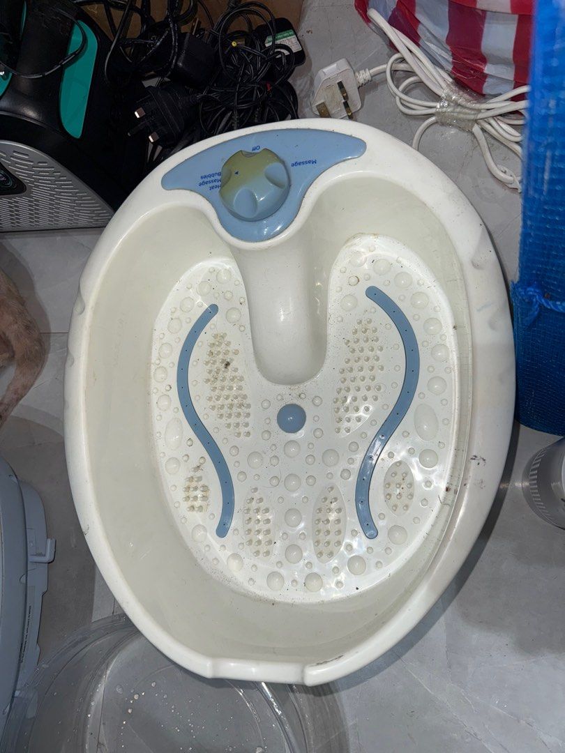 Foot Spa Massager (Category: Massage Devices) located in Pilar. Submitted by faveanyshop (Listing ID 1396448256, Image 2). Description: - Foot spa massager - Adjustable settings dial - White basin with blue accents - Features massage nodes - Central water reservoir - Ready to use - Good working condition.
