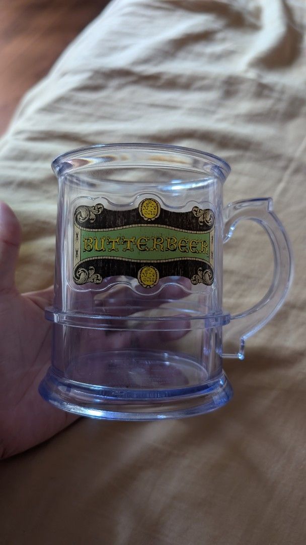 Harry Potter Butterbeer Mug Universal Studios Japan (Category: Coffee & Tea Tableware) located in Rizal. Submitted by sheitla (Listing ID 1396290680, Image 2). Description: Butterbeer Mug from Harry Potter Wizarding World Japan - Clear plastic mug - Features a Butterbeer label - Cylindrical shape with handle - Perfect for Harry Potter collectors No issues RFS: Decluttering Message me for additional pictures or inquiry.