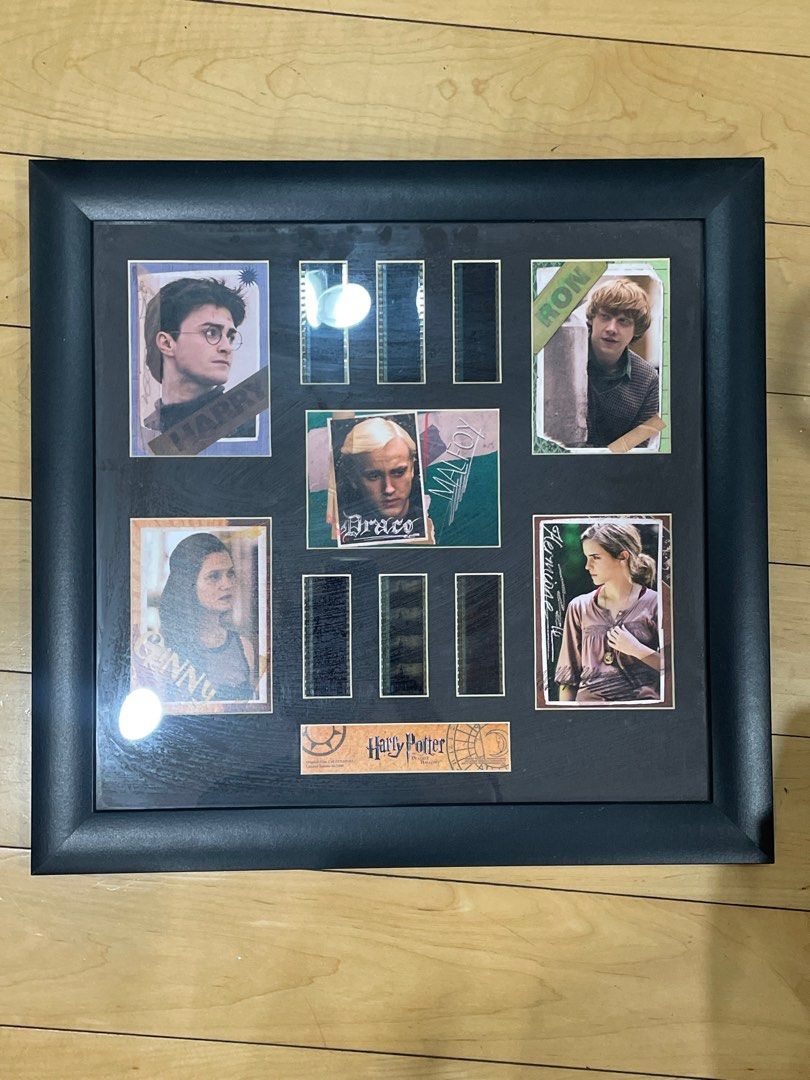 Harry Potter Framed Film Strip Artwork (Category: Frames & Pictures) located in Quezon City. Submitted by ag.decluttering (Listing ID 1396395535, Image 1). Description: - Framed artwork featuring Harry Potter characters. - Includes Harry, Ron, Hermione, Draco, and Ginny. - Features film strip imagery. - Black, square frame. - Ideal for Harry Potter fans..